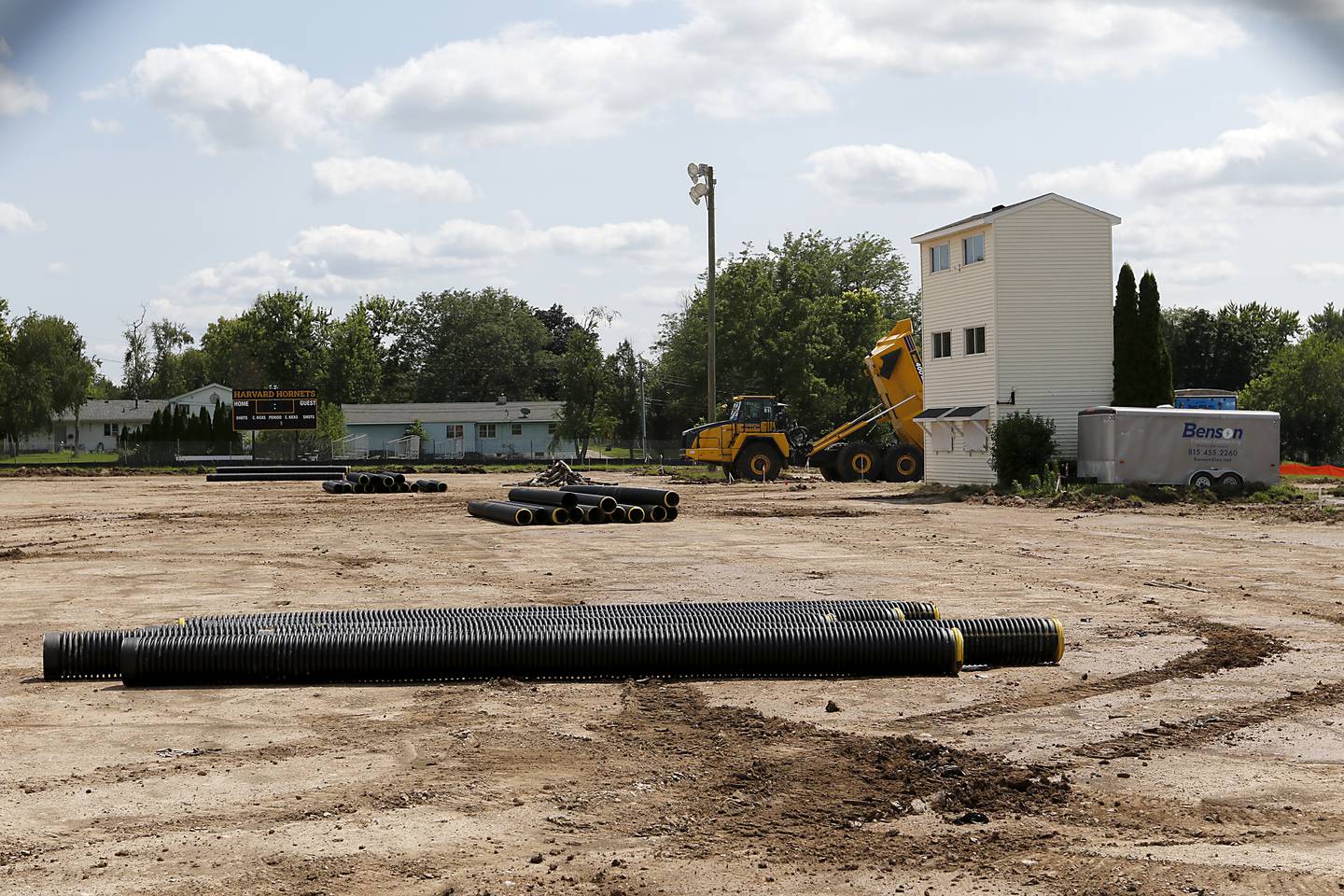 Construction continues on Thursday July 25, 2024 on the new artificial turf field at the Harvard Junior High School.