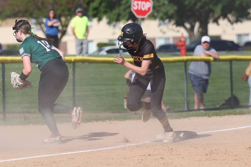 Joliet West’s Shelby Fraser heads home on a wild throw against Plainfield Central on Wednesday, May 15, 2024 in Joliet.