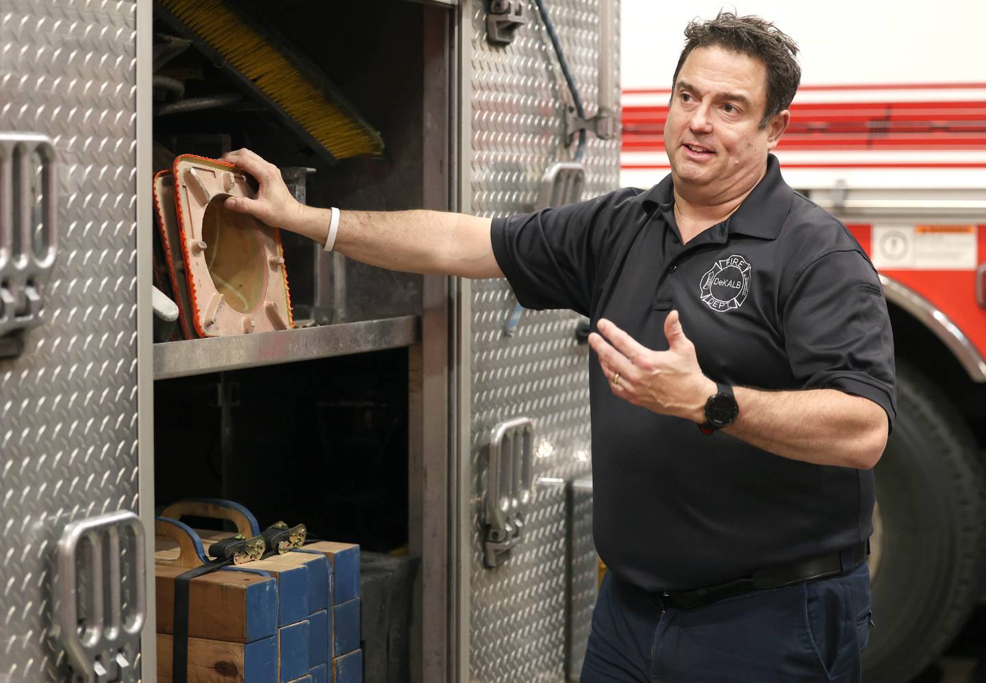 DeKalb firefighter/paramedic Pat Eriksen talks Wednesday, April 17, 2024, at the DeKalb Fire Department Fire House No. 1, about the gear the truck he drives carries on board.