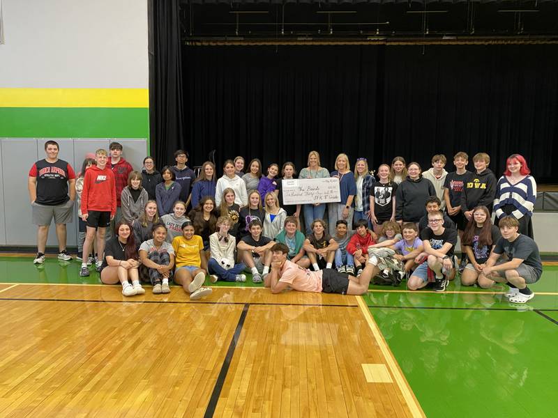 Students at JKF in Spring Valley were able to present a check to their school nurse for just over $600 to help with the medical costs for her husband who is battling cancer.