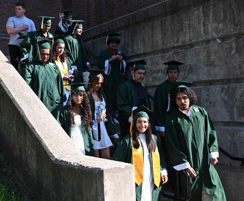 Students walk toward their staging area prior to the start of the Glenbard West graduation ceremony on Thursday, May 23, 2024 in Glen Ellyn.