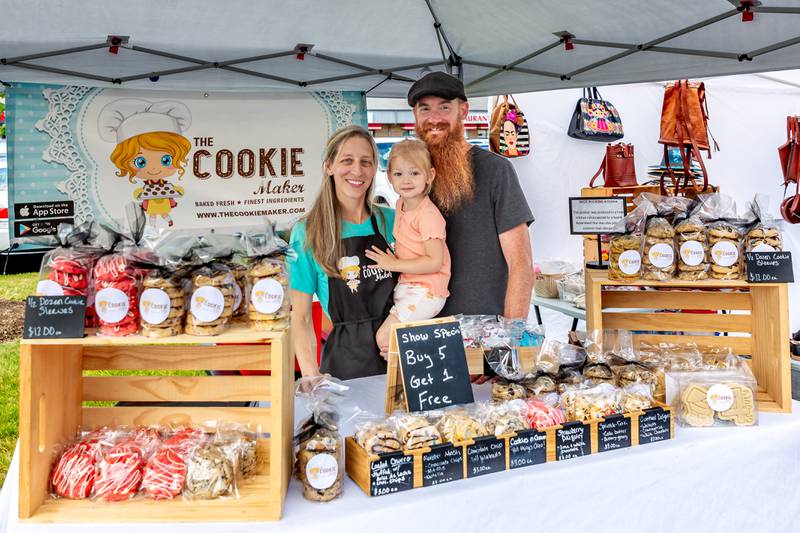 Cookie Maker owner Heather Kratz with her husband Dennis and daughter Maclyne at the Winfield Farmer's Market in Winfield, IL.  July 3rd, 2024.