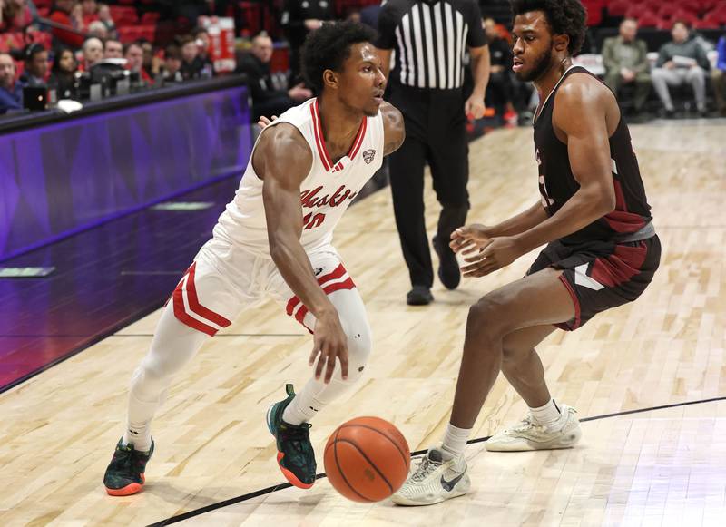 Northern Illinois' Zion Russell drives by Calumet’s Reginald Loury during their game Monday, Dec. 18, 2023, at the Convocation Center at NIU in DeKalb.