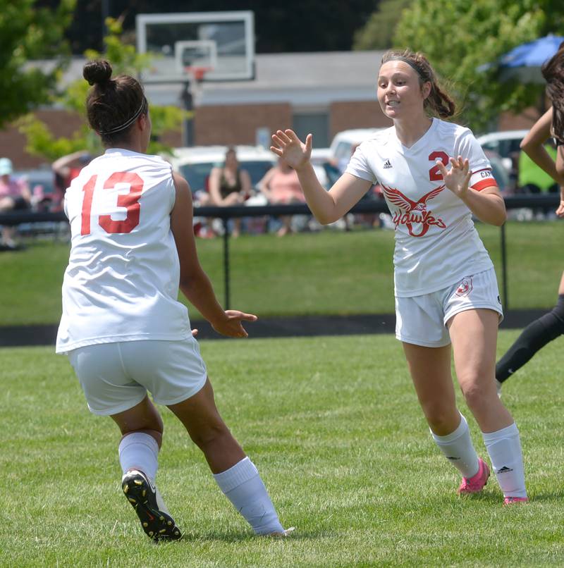 Oregon's Sarah Eckardt (left) and Anna Stender celebrate after Stender scored a goal on Eckardt's assist to give the Hawks their only score in a 2-1 loss to Stillman Valley at  the 1A Indian Creek Sectional on Saturday, May 18, 2024.