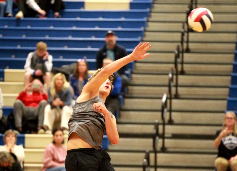 Geneva’s Michael Loberg spikes the ball over the net during a game against Wheaton Warrenville South at Geneva on Tuesday, April 2, 2024.