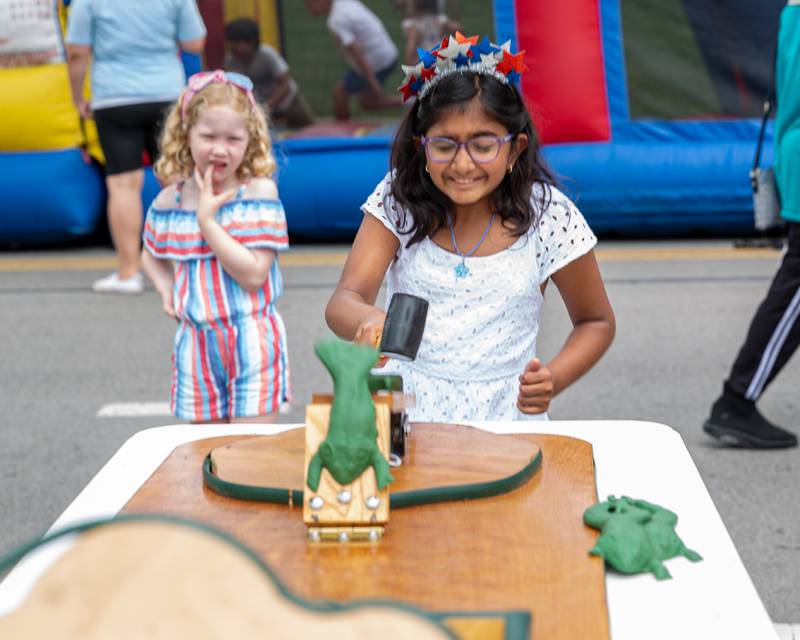 Reya Nallapareddy plays a game at the Hinsdale 4th of July Family Celebration.  July 4th, 2024.