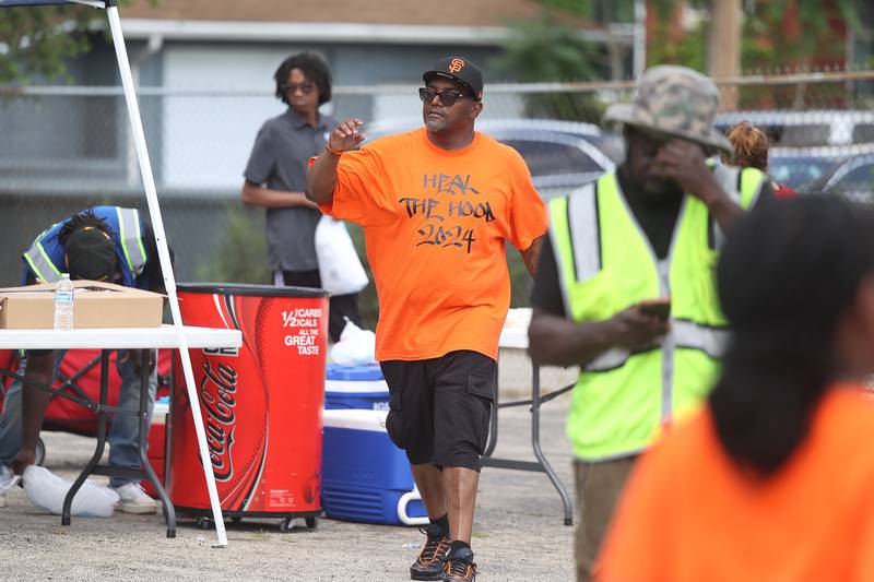 Jaron Nabors Sr., one of the event organizers, makes his rounds at the Healing the Hood event held at the St. Mark CME Church in Joliet on Saturday June 29, 2024.