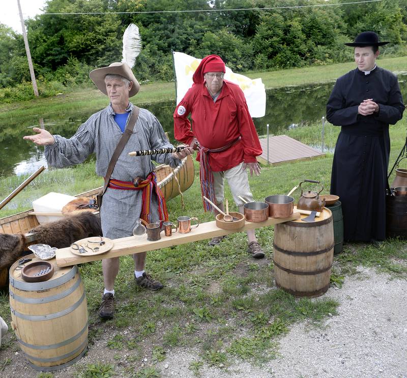 A group of French voyageurs including Louis Jolliet and Father Marquette explain their journey to the Illinois Valley in the 1670s on Saturday, July 8, 2023, in Ottawa. Explanations of period tools as well as hunting and cooking utensils were part of the program during Canal Day celebrating the 175th anniversary of the Illinois and Michigan Canal opening.