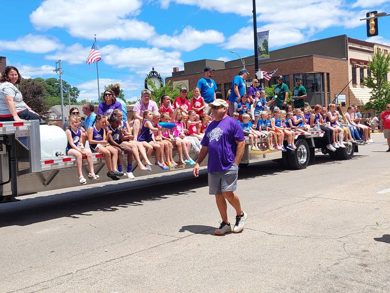 Streator Youth Softball participants ride on a trailer Sunday, June 30, 2024, through the Liberty Fest parade in Streator.