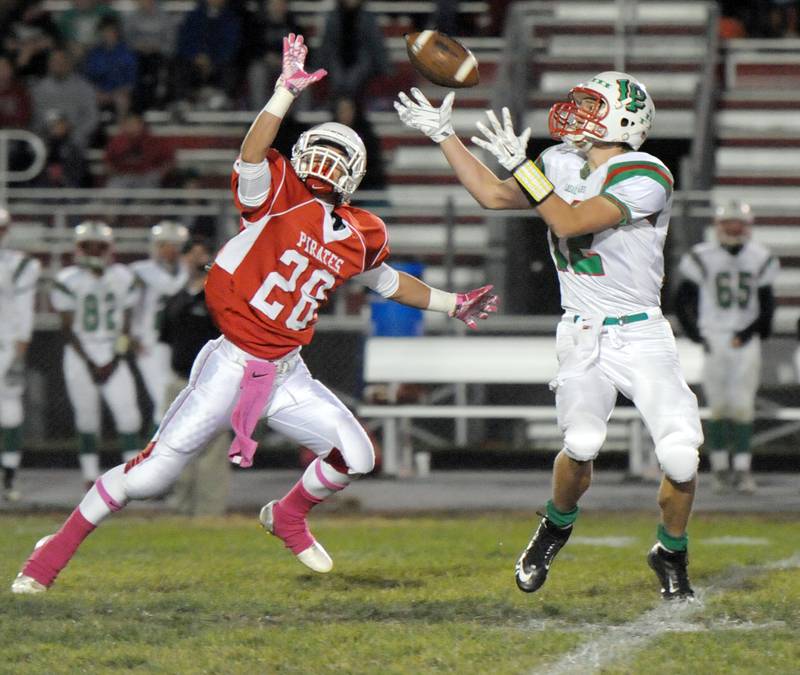 La Salle-Peru's Ryan McManus hauls in a catch just out of the reach of Ottawa defender Julian Hamill in the 2014 game.