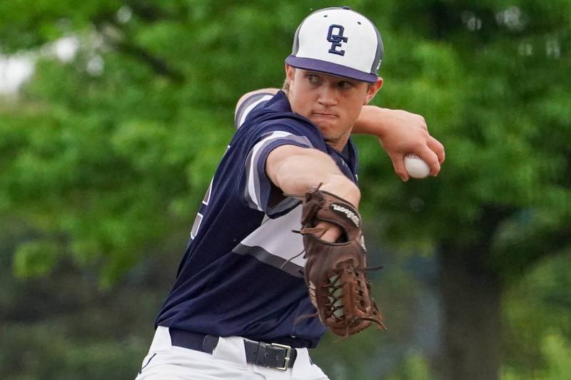 Oswego East's Jackson Petsche (22) delivers a pitch against Oswego during a baseball game at Oswego High School on Monday, May 13, 2024.