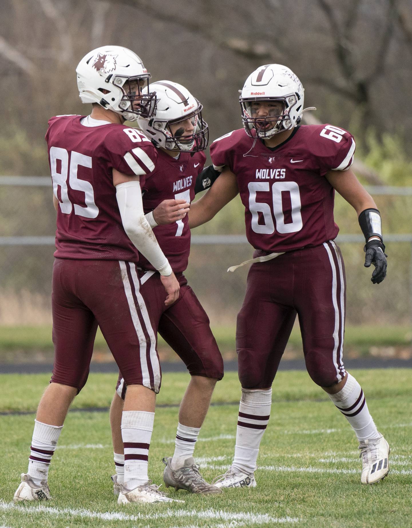 Prairie Ridge quarterback Tyler Vasey, center, celebrates a touchdown in the 3rd quarter against Kaneland with teammates Landon Miller, left, and Fernando Rodriguez during the 6A second-round football playoff game on Saturday, November 5, 2022 at Prairie Ridge High School in Crystal Lake. Prairie Ridge won 57-22.