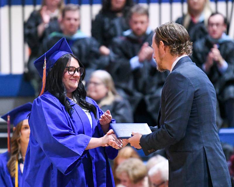 Genoa-Kingston senior Paige Sommers is all smiles as she receives her diploma during her graduation ceremony held Saturday, May 18, 2024, Genoa-Kingston High School, 980 Park Ave., Genoa.
