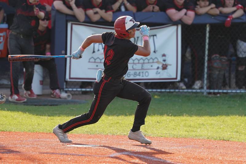 Yorkville's Jailen Veliz (12) hits a two run single against Neuqua Valley' during a Class 4A Neuqua Valley Regional semifinal baseball game at Neuqua Valley High School in Naperville on Thursday, May 23, 2024.