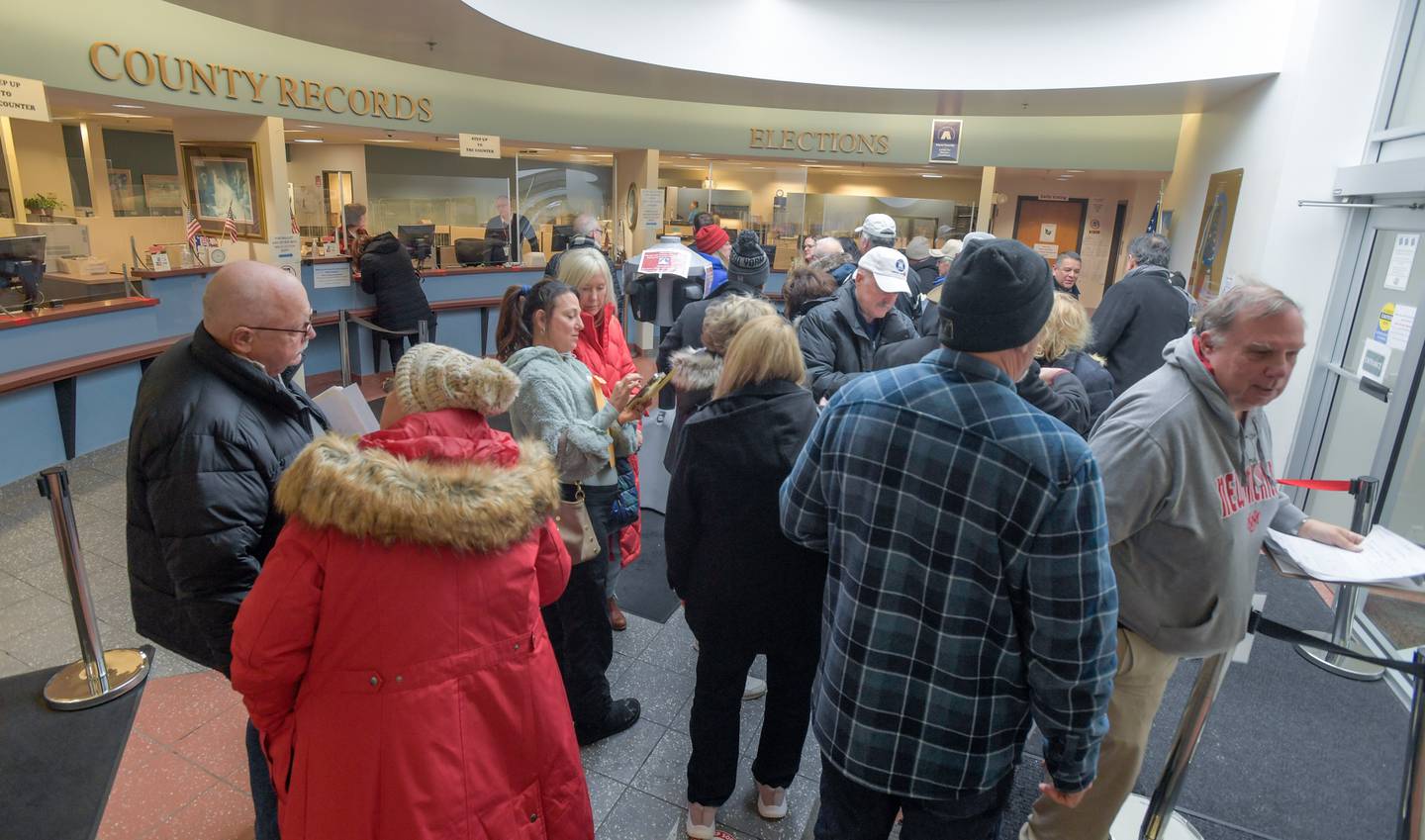 Candidates lineup in the lobby of the Kane County Clerk's office to file their petitions for the 2024 election on Monday, November 27, 2023.