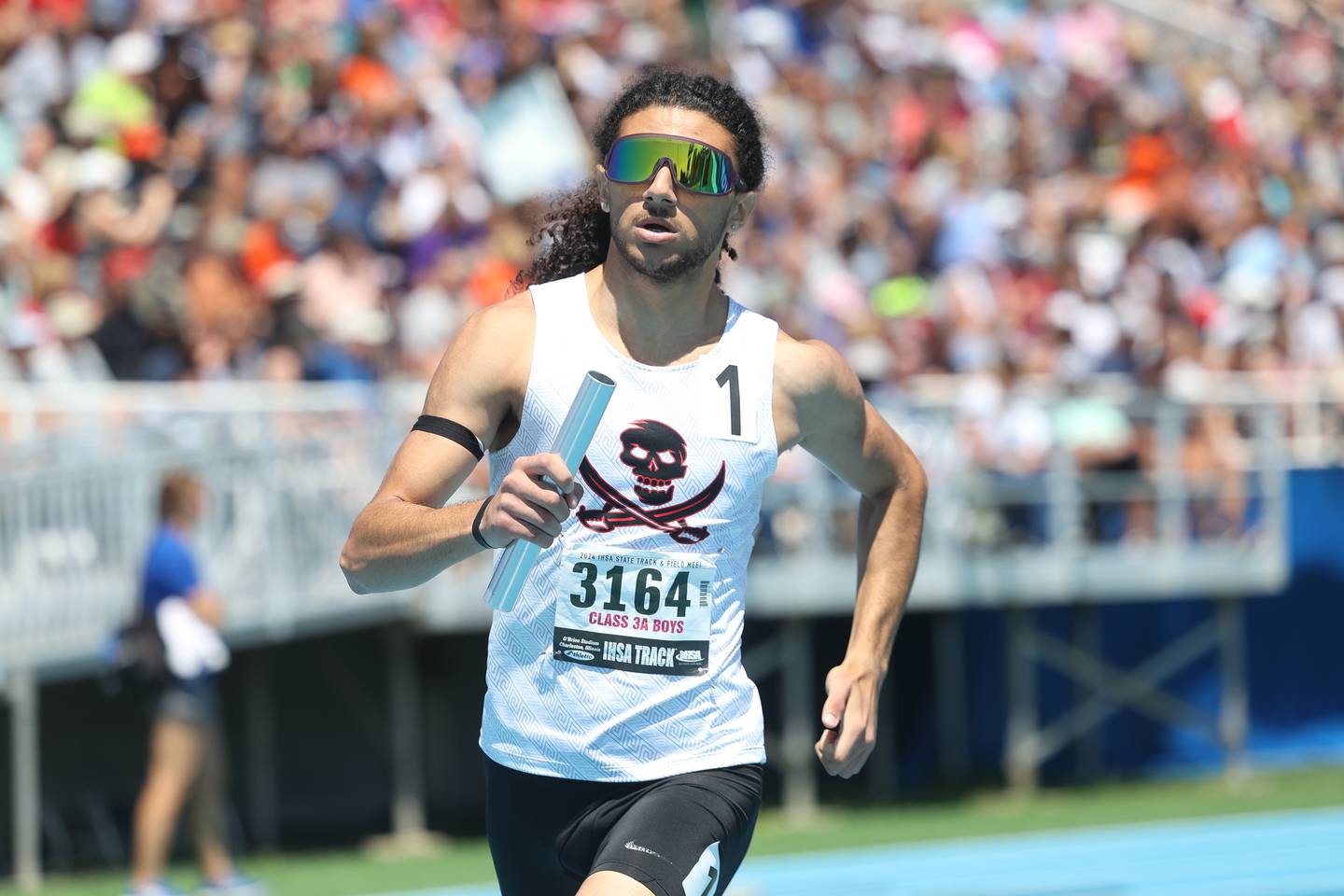 Bolingbrook’s Hussein Almousawi rounds a turn in the Class 3A 4x800 relay Saturday, May 25, 2024, in Charleston.
