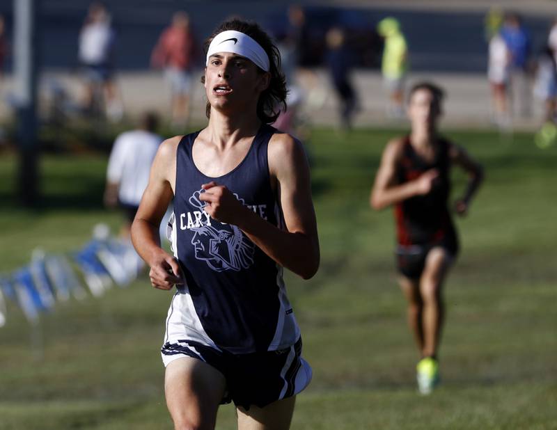 Cary-Groves Ethan Wadell runs to the finish line during the boys race of the McHenry County Cross Country Meet Saturday, August 27, 2022, at Emricson Park in Woodstock.