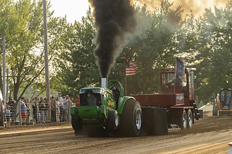 Travis Wileman starts off the pro stock class at the Badger State Tractor Pullers event Wednesday, August 9, 2023 at the Carroll County fair.