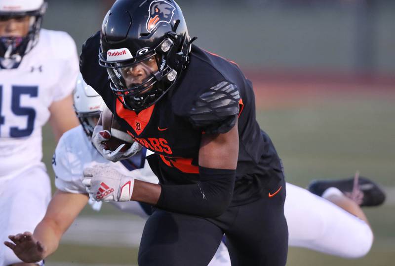 DeKalb’s Davon Grant breaks a Plainfield South tackle on his way to the end zone for a long touchdown catch during their game Friday, Sept. 1, 2023, at DeKalb High School.