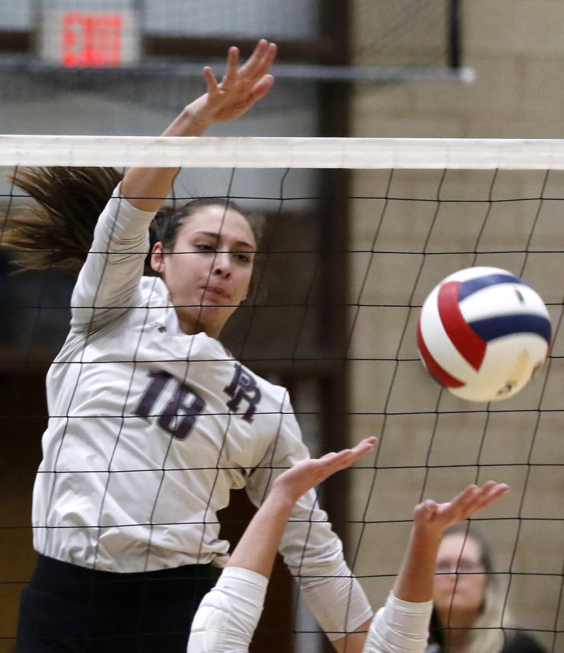 Prairie Ridge's Maizy Agnello hits the ball strait down over the net during the Class 3A Woodstock North Sectional finals volleyball match against  Belvidere North on Wednesday, Nov. 1, 2023, at Woodstock North High School.