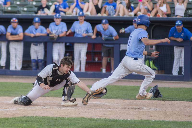 Joliet Catholic’s Ryan Louthan misses the tag against Columbia’s Dom Voegele Friday, June 3, 2022 during the IHSA Class 2A baseball state semifinal.