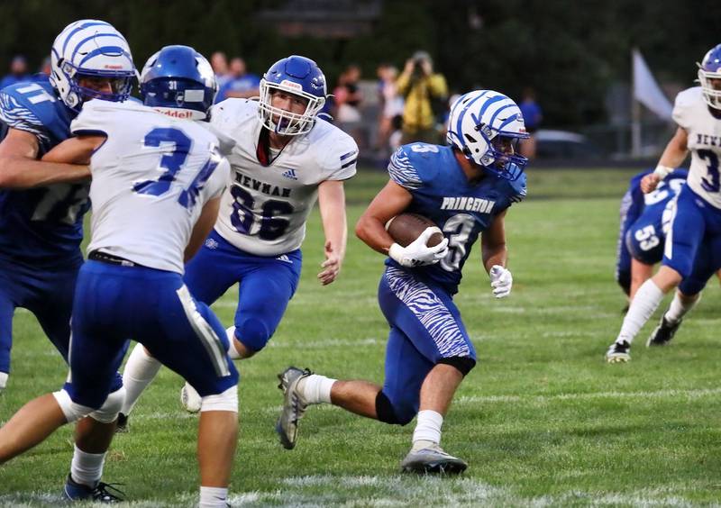 Princeton's Ace Christiansen gets through the Newman defense Friday night at Bryant Field. The Tigers won 28-14.