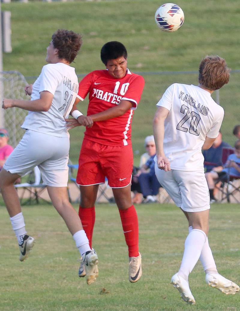 Ottawa's Michael Bedolla puts a header on the ball between Kanelands Manny Cepeda and Jackson Boryc defend on Wednesday, Sept. 11, 2024 at King Field.