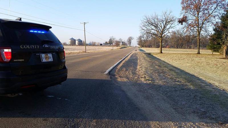 A DeKalb County Sheriff's Office vehicle blocks access to Plank Road at its intersection with Lukens Road on Saturday morning in rural Sycamore. The stretch between Lukens and Moose Range roads was closed about seven hours, from about 7 a.m. to about 2 p.m., after an eastbound semi-trailer hauled by a 2014 Freightliner driven by Alexis Palencia, 25, of Hampshire, slid into the south ditch and took out a utility pole, according to a news release from the DeKalb County Sheriff's Office.