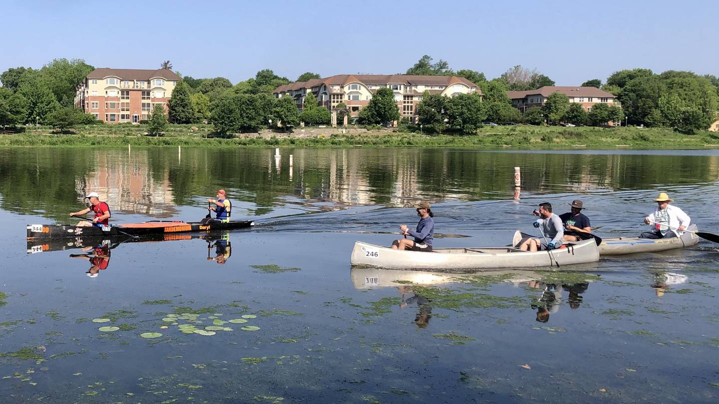 Racers paddle on the Fox River in Geneva Saturday morning June 3, 2023 during the Mid-American Canoe and Kayak Race.