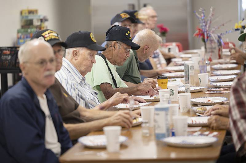 Veterans feast on donuts and breakfast pizza Thursday, July 11, 2024 at the Whiteside County Senior Center. On this day, donuts were provided by Rock River Hospice and pizza by the Citadel.