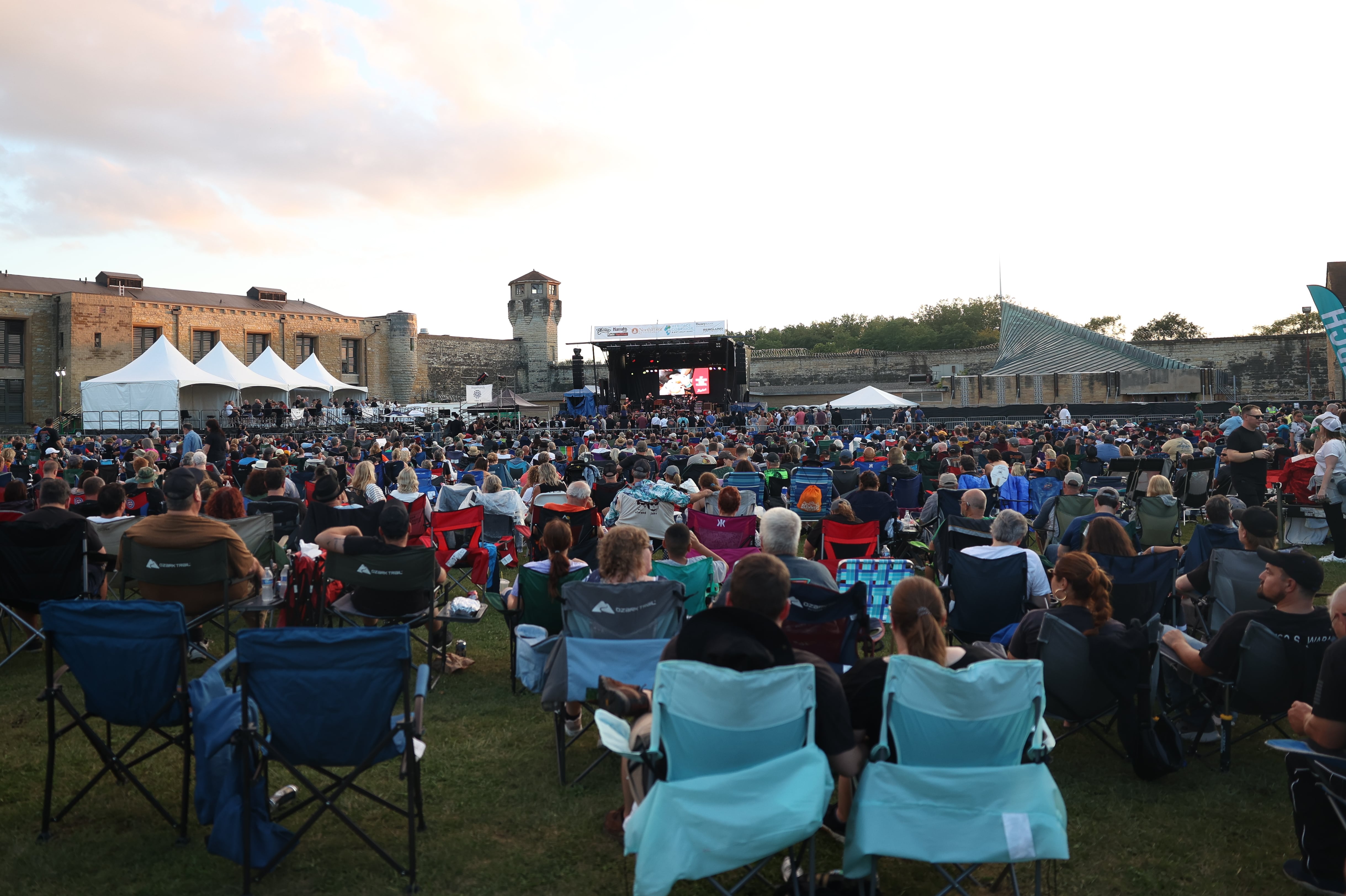 Thousands of people pack the lawn at the Old Joliet Prison for Blues Brothers Con: The Sequel on Saturday, Aug. 17, 2024 at the Old Joliet Prison.