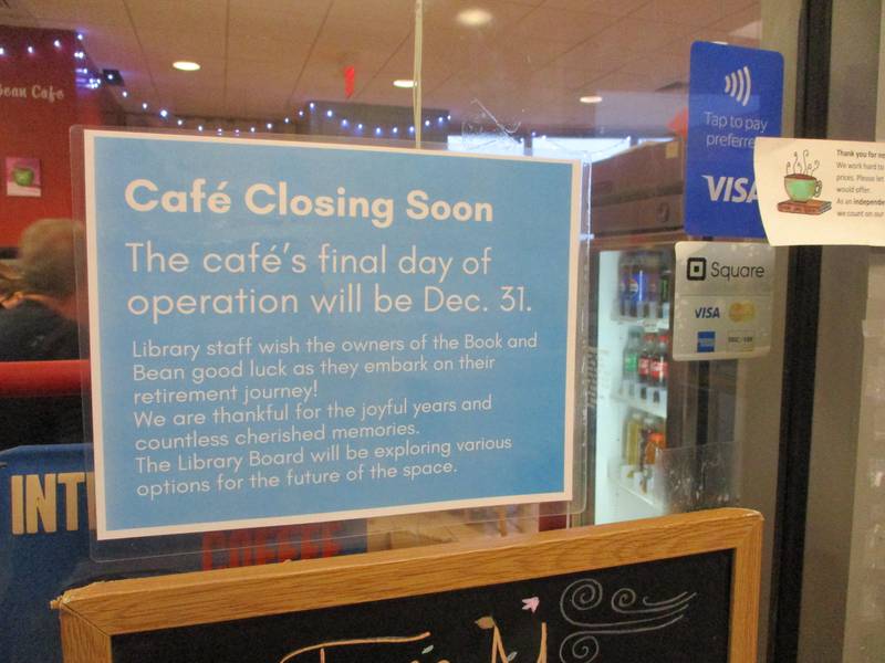 Sign outside the Book and Bean Cafe announces the pending closing of the popular cafe at the Joliet Public Library Black Road Branch. Dec. 2, 2023.