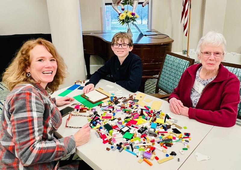 Oak Trace residents, friends, families and staff participated in the senior living community's second annual Lego celebration. Pictured are Oak Trace resident Kay McKay, right, with her daughter Kathy and grandson Steven.