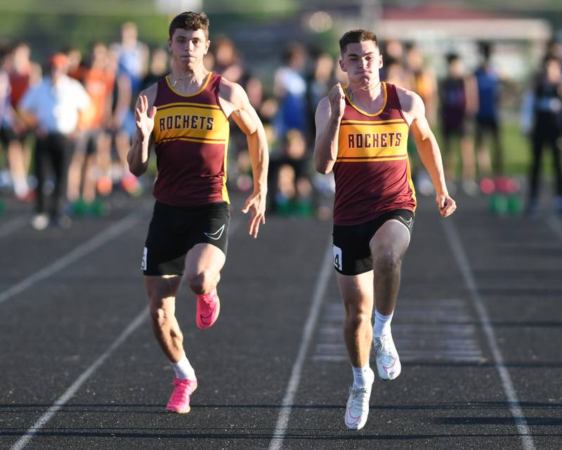 Jack Martens, right, and teammate Max Loveall of Richmond-Burton compete in the 100 meter dash during the Kishwaukee River Conference track meet held on Tuesday May 7, 2024, at Plano High School.