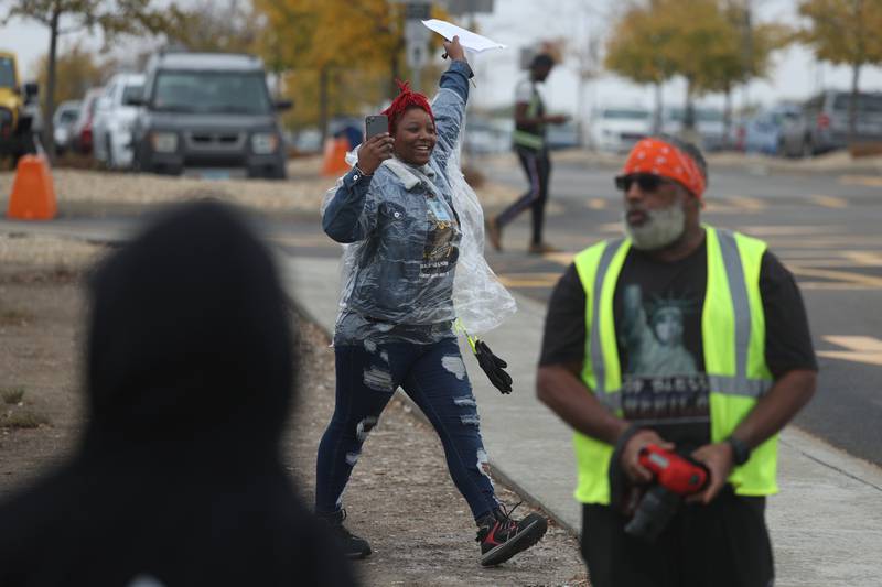An Amazon employee is one of the first to walk off the job at the MDW2 facility during a staged workout on Tuesday, October 11th in Joliet. Amazon employees of MDW2 are teaming with Workers for Justice, a nonprofit organization supporting warehouse workers, to demand a safer work place and jobs that offer a living wage.