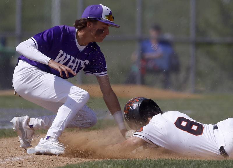 Hampshire's Jack Perrone takes out McHenry's Ryan Nagel as he slides into third base during a Class 4A Hampshire sectional baseball game on Wednesday, May 29, 2024, at the Hampshire High School.