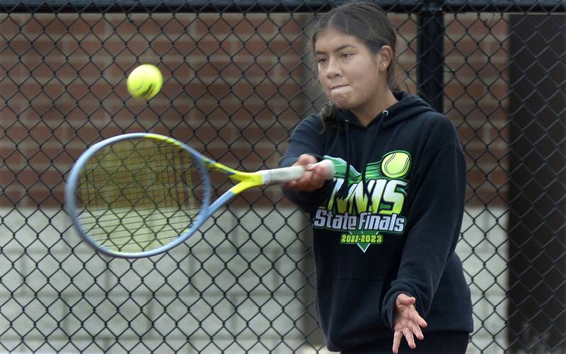 LaSalle Peru’s Eva Cervantes during singles play against Ottawa’s Layne Krug Saturday during the IHSA Tennis Sectional in LaSalle