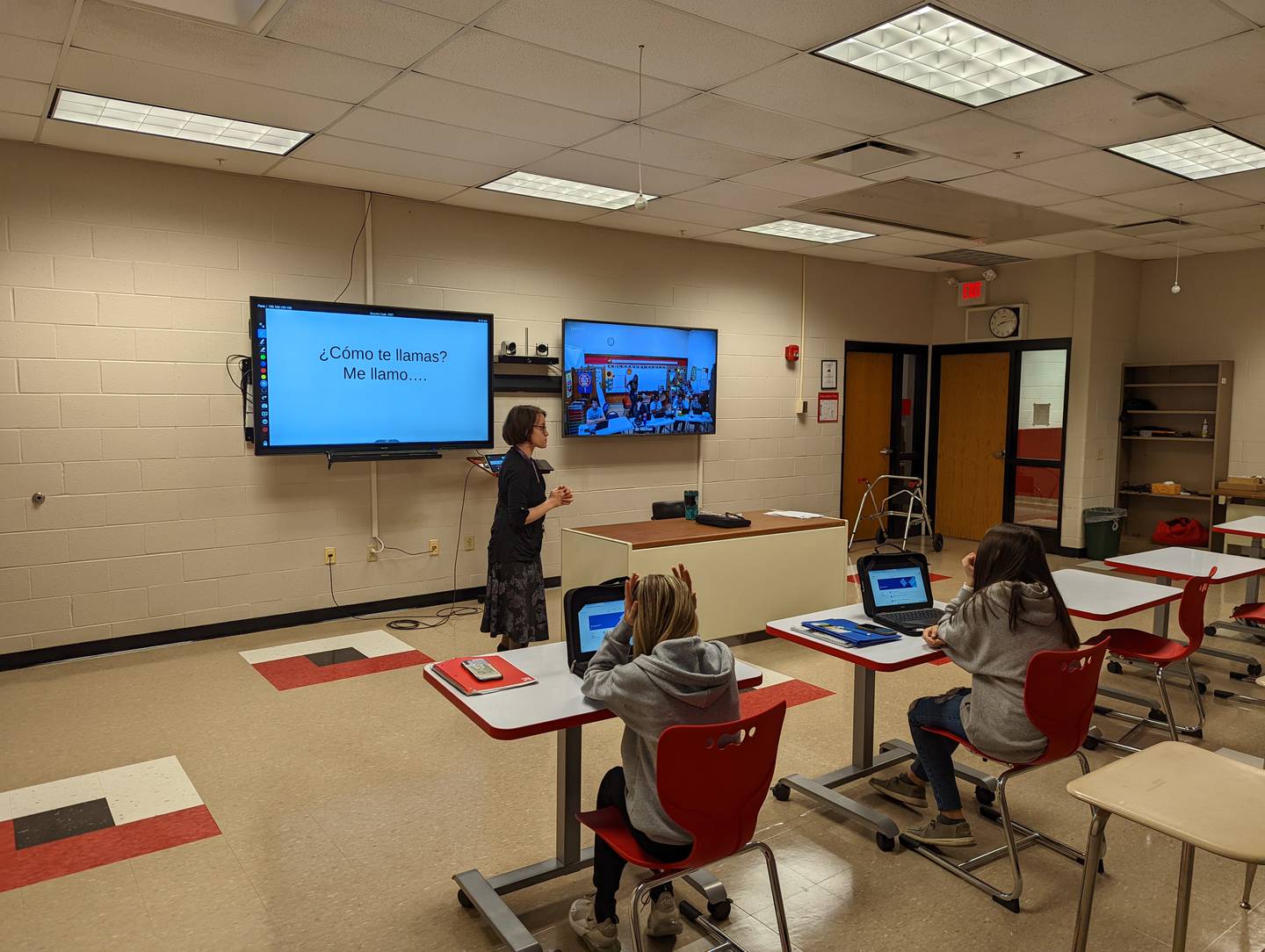 Streator High School Spanish instructor Kristina McCormick leads a blended classroom of high school and junior high school students, using video technology to teach students at St. Michael the Archangel Catholic School.