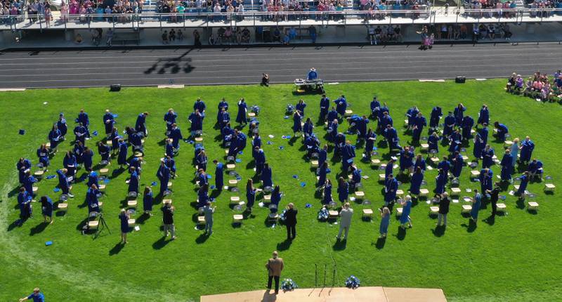 Princeton class of 2024 graduates throw their caps as they graduate on Saturday, May 18, 2024 at Princeton High School.