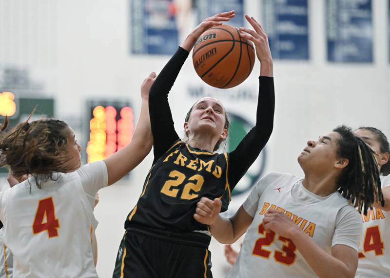 Fremd’s Ella Todd gets a rebound agianst Batavia’s Addi Lowe and Addison Prewitt in the Bartlett supersectional game on Monday, Feb. 26, 2024.