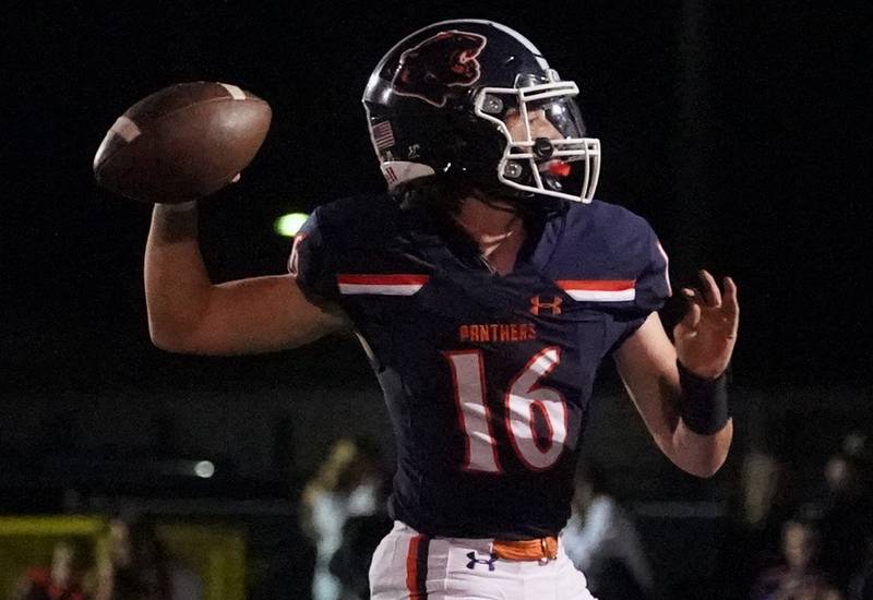 Oswego’s Brett Connolly (16) throws a pass against West Aurora during a football game at Oswego High School on Friday, Sept. 29, 2023.