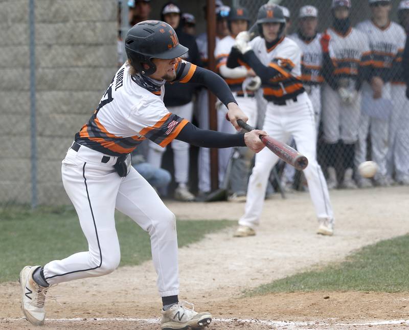 McHenry’s Logan Wirtz tries to bunt during a Fox Valley Conference baseball game Friday, April 15, 2022, between Jacobs and McHenry at Petersen Park in McHenry.