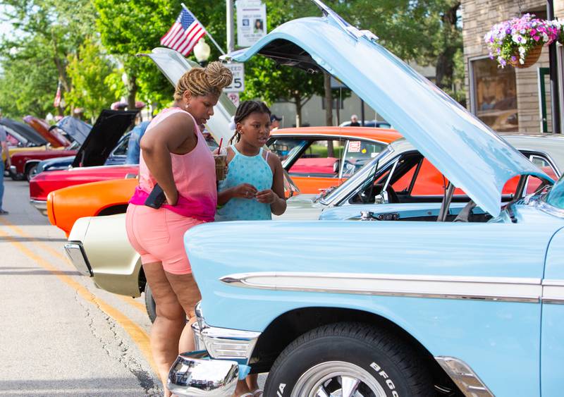 Levita Boatright and her daughter Virtue Boatright,9,of Westmont admire the engine of a 1956 Chevrolet Bel Aire during Cruisin’ Night in downtown Westmont, Thursday, June 6, 2024.

Suzanne Tennant/ For Shaw Local News Media