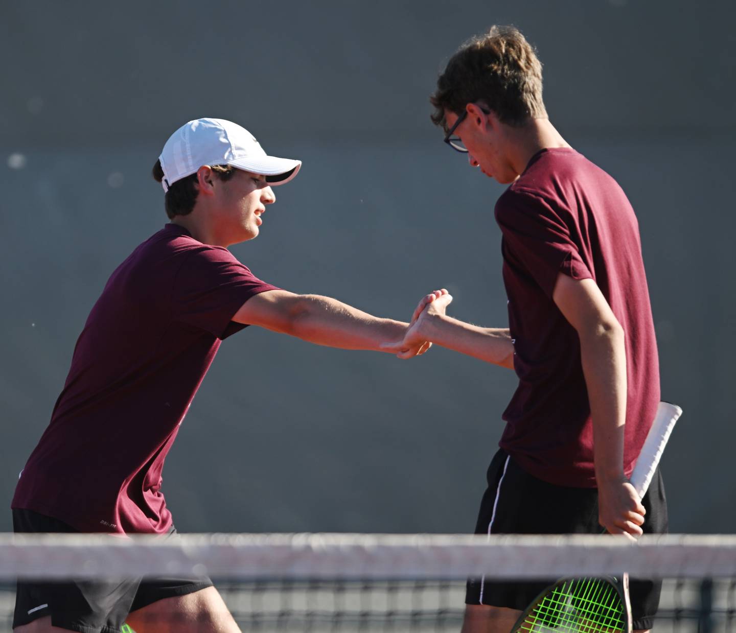 Cole Palese, left, and Tim Jones of Prairie Ridge celebrate a point during Class 1A doubles consolation semifinal of the boys state tennis tournament at Palatine High School on Saturday, May 25, 2024 in Palatine.