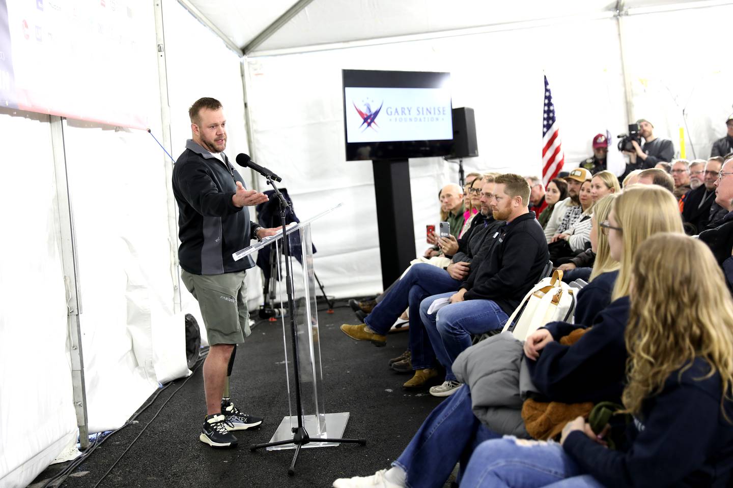 Retired U.S. Army Chief Warrant Officer 2 Patrick Scrogin speaks during a dedication for his family’s newly constructed, specially adapted smart home in St. Charles on Thursday, Jan. 18, 2024. The mortgage-free home was made possible by the Gary Sinise Foundation.