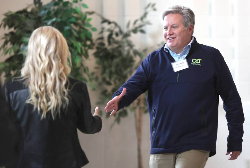 Jim Doherty, of OLT Marketing, is congratulated as he accepts the Spirit of Small Business Award from RoseMarie Treml during the annual meeting of the Sycamore Chamber of Commerce Thursday, April 7, 2022, at St. Mary Memorial Hall in Sycamore.