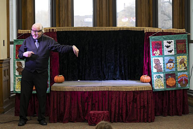 Dave Herzog gestures to the stage he will perform his marionette show on Thursday, Nov. 16, 2023 at the Dixon library. Dixon native Herzog came back to his hometown to ply the craft he has been working on for 50 years.