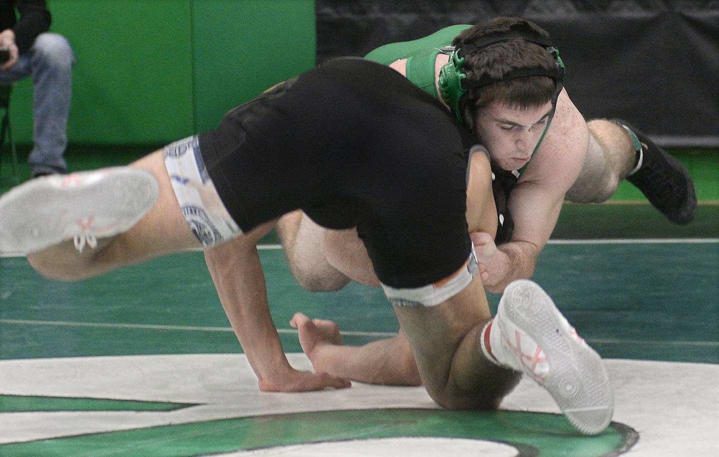 Seneca’s Collin Wright works to bring down Evergreen Park’s Aseal Rubalcava in the 170 weight class championship match on Saturday, Dec. 3, 2022 at Seneca.