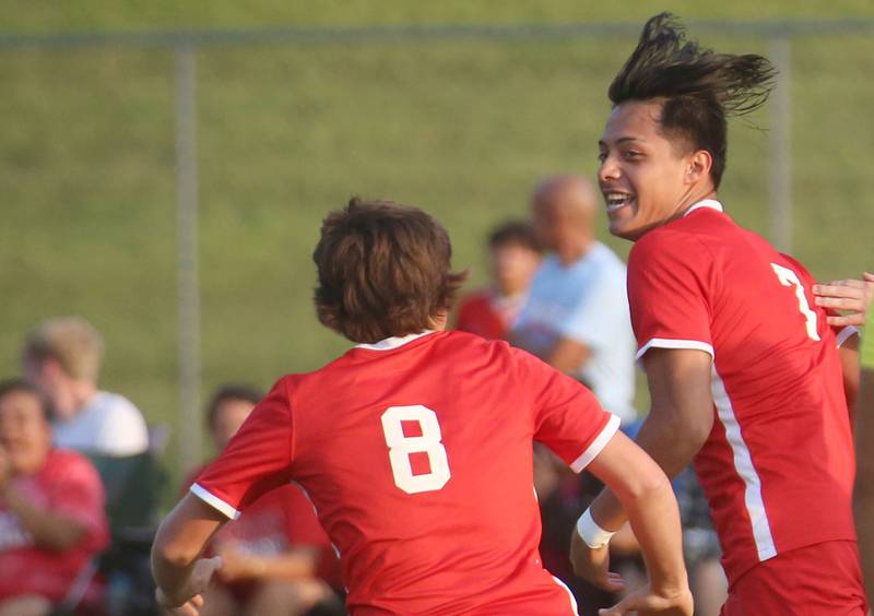 Ottawa's Mason Jaegel ceelebrates with teammate Jorge Lopez after Lopez scored the teams first goal against Kaneland on Wednesday, Sept. 11, 2024 at King Field.