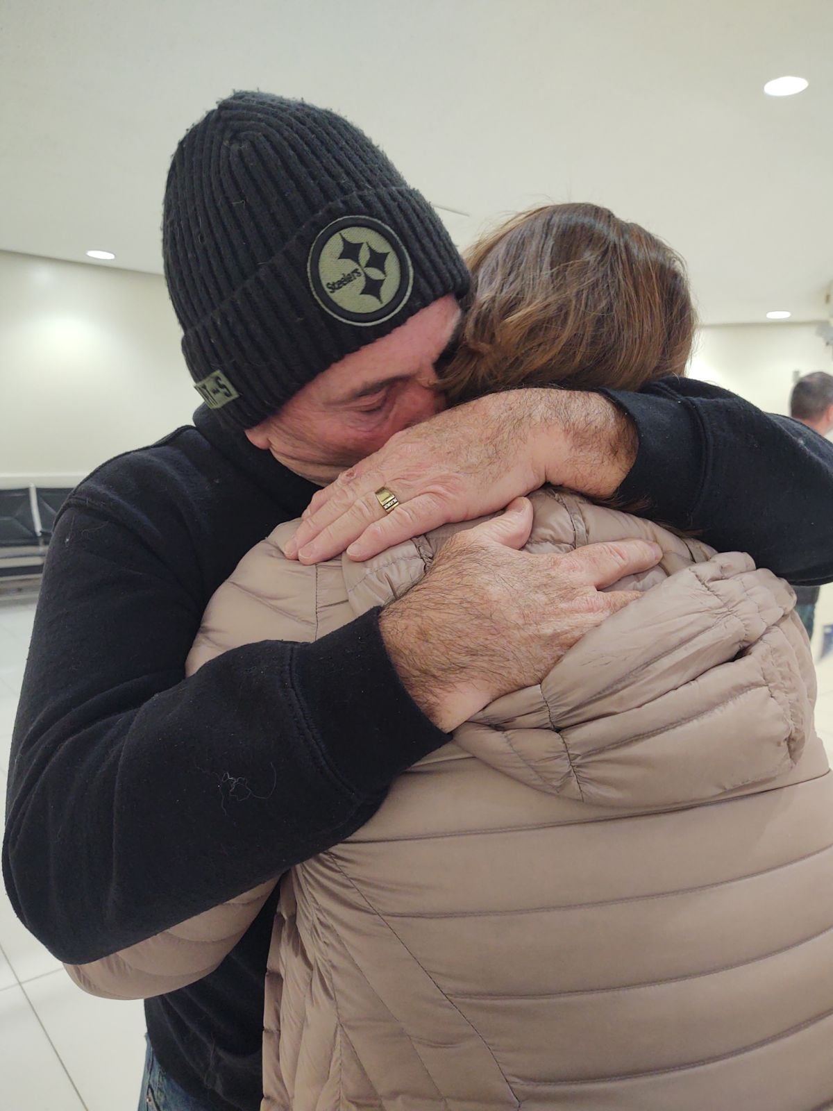 Brother and sister finally meet. Deb Myers of Utica embraces brother Keith Brannan, now of Florida, in February 2024 at Ronald Reagan Washington National Airport. Their mother, the late Barbara Sullivan Brannan, left when Deb was a baby and with Keith on the way. DNA testing enabled them to make contact at Christmas 2023.